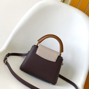 Alternative view of p105031.05 x 20.0 x 11.0 cm (L x H x W) 27.0 x 17.3 x 9.0 cm (L x H x W) 21.0 x 13.6 x 8.0 cm (L x H x W) • Taurillon calf leather • Calf leather trim •Cowhide leather lining•Metal hardware•Flap can be positioned inside or outside•Zippered interior pocket•Interior patch pocket•Metal studs•Holds smartphone, LV Vertical wallet, headphones, and keys•Strap: Detachable, adjustable•Strap half-length: 45.5 cm•Strap half-length adjustable to: 53.0 cm•Handle: Single handle